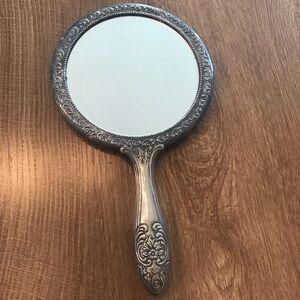 Vintage Handheld Mirror with Ornate Silver Frame